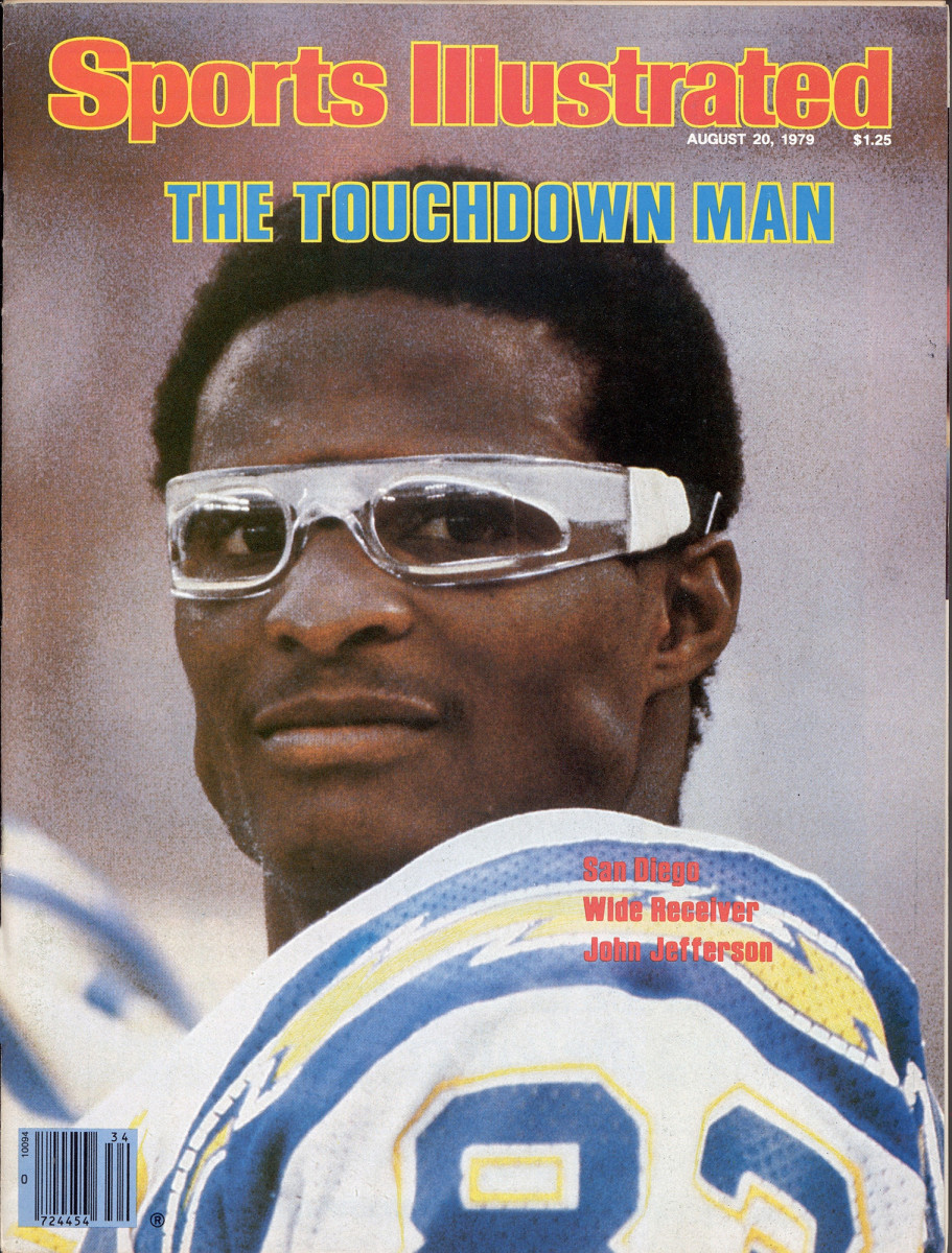 John Jefferson looks to the side with glasses on